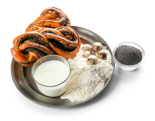 Tray with tasty poppy seed buns and ingredients on white background