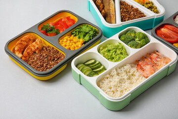 Containers with healthy food on light table