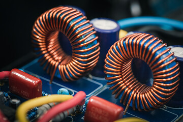 Inductor copper coil on circuit board - obrazy, fototapety, plakaty