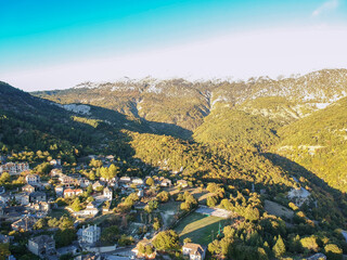Aerial panoramic view over the picturesque village Papigo in Epirus, Greece at sunset. Scenic...