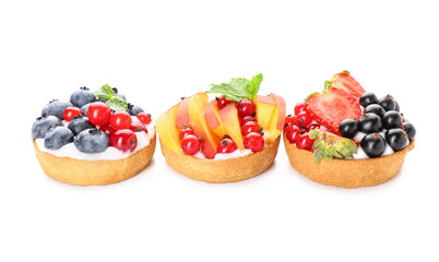 Tasty berry tartlets on white background
