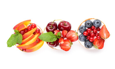 Tasty berry tartlets on white background
