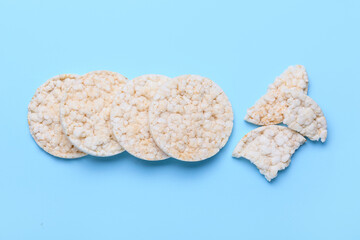 Crunchy corn crackers on color background