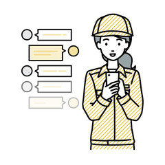 立ってスマートフォンで楽しくチャットで会話する作業員の女性