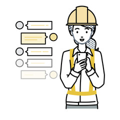 立ってスマートフォンで楽しくチャットで会話する工事現場の女性