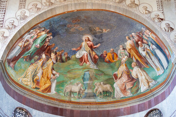 ROME, ITALY - SEPTEMBER 2, 2021: The fresco of Jesus among the saints in main apse of church...