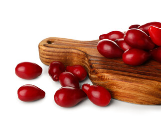 Board with red ripe dogwood berries on white background, closeup