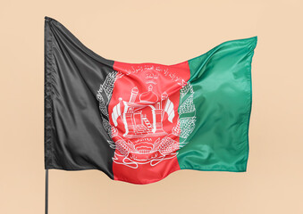 Waving flag of Afghanistan on beige background