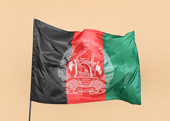 Waving flag of Afghanistan on beige background