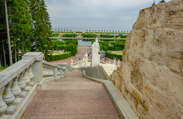 A long marble fence in the park in summer.