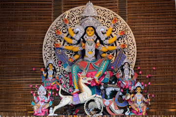 Idol of Goddess Devi Durga at a decorated puja pandal in Kolkata, West Bengal, India. Durga Puja is...