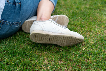 View of retro white reebok shoes on lady at the park