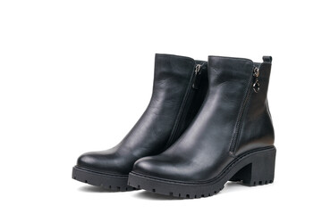 Black leather ankle boots for women made of leather isolated on a white background.