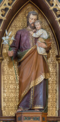 VIENNA, AUSTIRA - JUNI 24, 2021: The carved polychrome statue of St. Joseph in church Marienkirche.