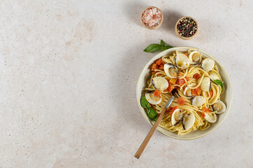 Traditional Italian seafood pasta with clams. Spaghetti alle Vongole. banner, top view, copy space.