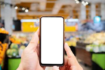 Mock-up of a smartphone with a white screen in the hands of a man.