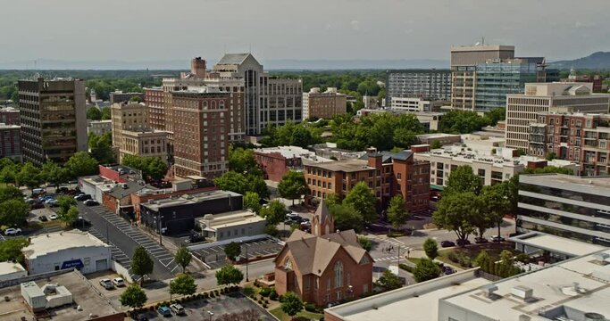 Greenville South Carolina Aerial v26 establishing pull out shot overlooking at downtown cityscape reveals church street ramp traffic - Shot with Inspire 2, X7 camera - May 2021