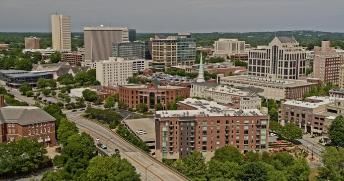 Greenville South Carolina Aerial v18 drone panning above academy street with traffic passing, overlooking downtown and west end cityscape - Shot with Inspire 2, X7 camera - May 2021