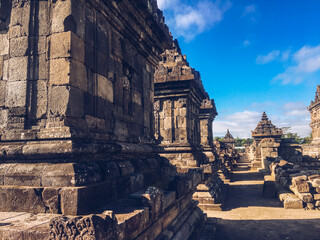 Many small Temple in Plaosan Complex temple with blue sky and sunny sun background. One of the javanese Buddhist temples located in Prambanan, Klaten, Central Java, Indonesia.