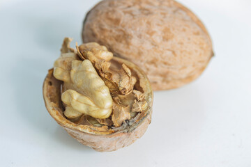  half a walnut close-up on a gray-white background