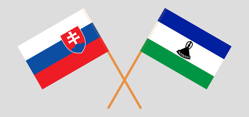 Crossed flags of Slovakia and the Kingdom of Lesotho. Official colors. Correct proportion