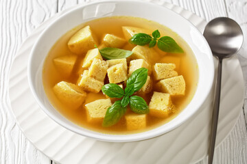 soup of chicken broth with parmesan egg dumplings