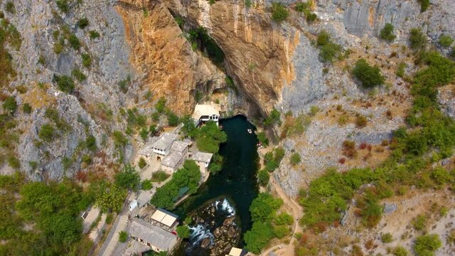Drone View Of Blagaj With Tekija On The Base Cliffs Along Buna River In Bosnia and Herzegovina. Aerial