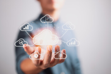 Businessman holding clouds big data analytics and business intelligence concept with chart and graph icons