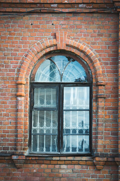 Old window with sun reflection, vertical image