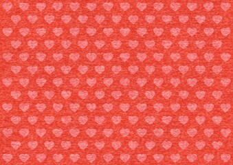 ハート模様のある赤色のフェルト生地の背景