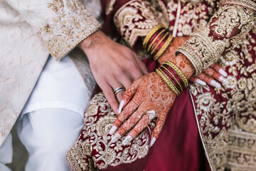 Fototapeta na wymiar Indian couple's holding hands close up