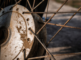old and dirty motorcycle drum due to dry mud
