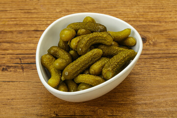 Pickled gherkin in the bowl