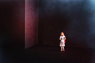 Concept image of getting stuck dead end situation. Woman standing in front of wall with no door - obrazy, fototapety, plakaty