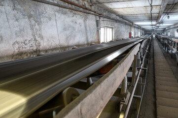 Belt conveyor system in an underground tunnel. Transportation of ore to the surface