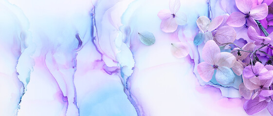 Creative image of pastel blue and purple Hydrangea flowers on artistic ink background. Top view...