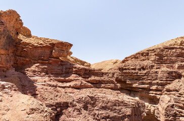 Narrow  passage between rocks in a nature reserve near Eilat city - Red Canyon, in southern Israel