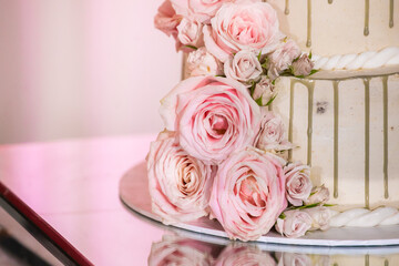 Beautiful wedding cake decorated with pink roses