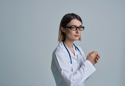 female doctor in white coat autoscope hospital professional