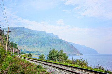 Around Lake Baikal railway near Slyudyanka. Siberian railway track with retaining wall, viaduct, tunnel