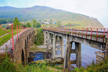 Around Lake Baikal railway near Slyudyanka. Siberian railway track with retaining wall, viaduct, tunnel