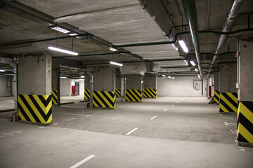 Empty parking place in a residential building. Covered underground parking for cars