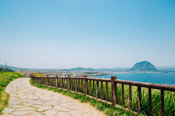 Songaksan Mountain trail with sea and Sanbangsan Mountain in Jeju Island, Korea