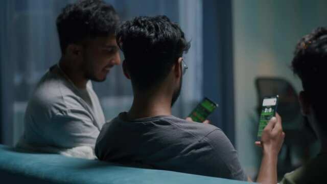 Indian guys discussing stakes in online app