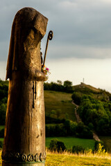 Fototapeta premium Walburga statue on the Walberla peak at sunset
