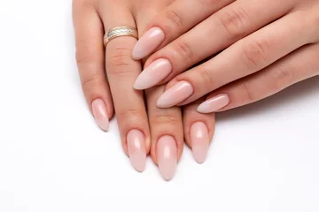 Rolgordijnen Wedding manicure white ombre on long sharp nails close-up on a white background © dina_shuba