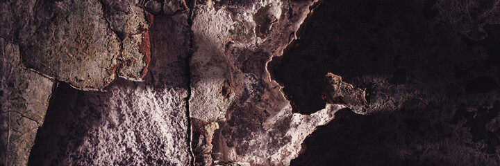 Peeling paint on the wall. Panorama of a concrete wall with old cracked flaking paint. Weathered rough painted surface with patterns of cracks and peeling. Grunge texture for wide panoramic background