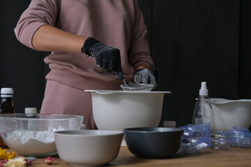 handmade bath bombs process. Preparation of bath bombs. Ingredients and floral decor on a wooden...