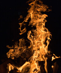 Fire creates endless shapes as it burns, flames and black backgrounds create interesting textures. Flame of Hell. Combustion power.