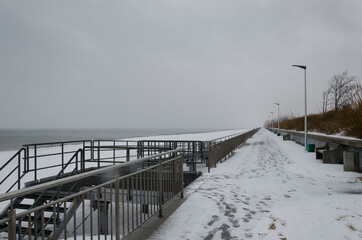SEA COAST IN WINTER - Snowstorm on the promenade
